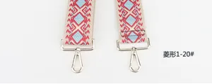 Colorful geometric embroidered wide bag strap replacement accessory with metal clasps.