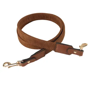 Brown suede bag strap detail showing leather ends and polished gold metal hooks replacement.