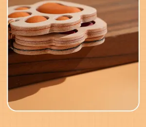 Close-up detail of cute cat paw leather car mirror pendant, premium vegetable-tanned craft.