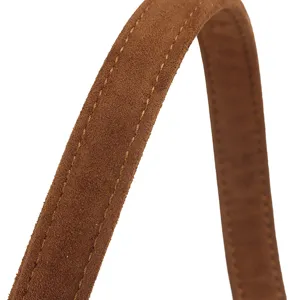 Detail view of brown leather replacement bag strap with contrast double stitching accessory.
