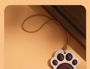 Detailed view of the cute cat paw leather hanging charm, genuine leather rearview mirror pendant