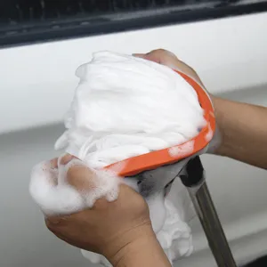 Telescopic car wash mop with soft milk silk bristles, long handle for easy vehicle cleaning.