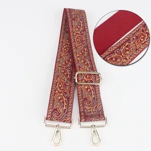 Tracolla di ricambio larga regolabile con motivo jacquard etnico e accessori metallici.