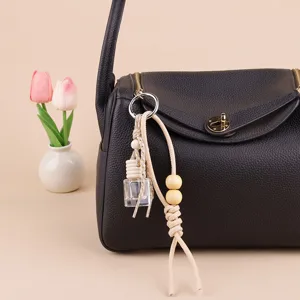Mini glass car perfume bottle bag pendant with wooden beads and leather strap for stylish decor.