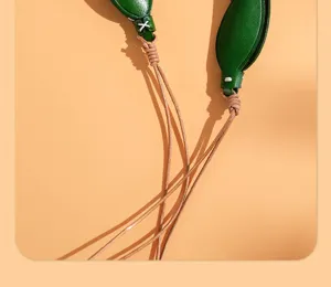 Leather tulip rearview mirror pendant detail close up craft stitching car charm deco