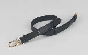 Black leather replacement bag strap detail, adjustable length with gold tone hardware clips.