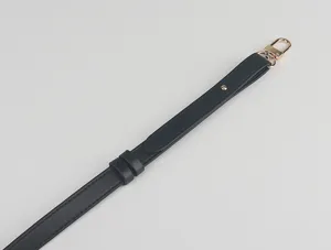 Adjustable black leather shoulder bag replacement strap detail with gold hardware.