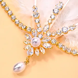 Closeup of vintage Gatsby feather rhinestone pearl headband for evening party hair accessory.