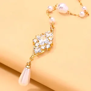 Close-up detail of exquisite Indian style pearl and crystal forehead ornament hair accessory.