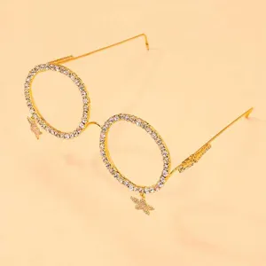 Rhinestone round decorative glasses frame with star pendants, gold fashion eyewear accessory.