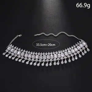 Detailed view of the exaggerated rhinestone crystal choker necklace with teardrop drops and chain.