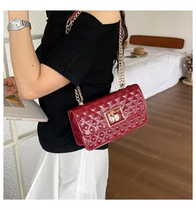 Red patent leather quilted chain shoulder bag, stylish quilted design with metal chain strap.