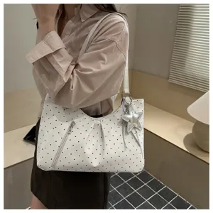Korean style polka dot shoulder tote bag detail view with cute star pendant and zipper pocket.