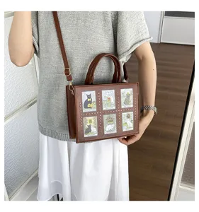 Detailed view of brown leather crossbody bag featuring tarot cat prints and metal stud decor.