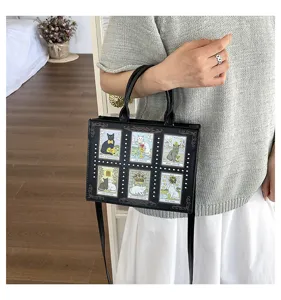 Black PU leather handbag with cute tarot cat prints and retro metal studs, stylish tote bag.