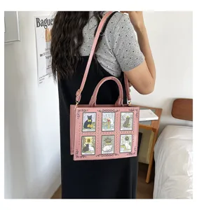 Pink leather tote bag featuring cute cat tarot card prints and vintage metal rivets for women.