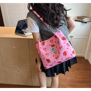 Pink strawberry cherry print canvas shoulder tote bag with stylish chain straps for daily use.