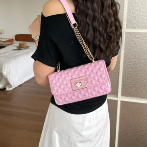Pink quilted chain shoulder bag for women, stylish crossbody bag with metal lock and strap.