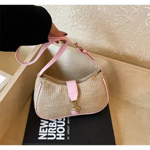Straw shoulder underarm bag with pink trim, stylish casual hobo bag for women daily commute.