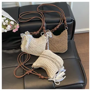 Handcrafted mini knitted crossbody bag with pearl lace decor, lightweight woven shoulder bag.