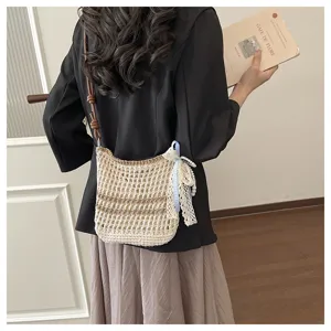 Handmade crochet crossbody bag detail, lightweight mini knitted phone bag with lace.