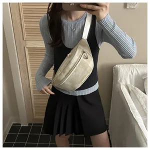 Detailed shot of casual crossbody chest bag with plaid pattern and white adjustable strap.