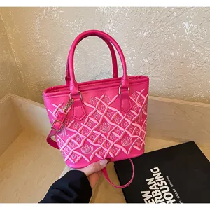 Hot pink stylish women handbag with chic crisscross embroidery and shoulder strap design.