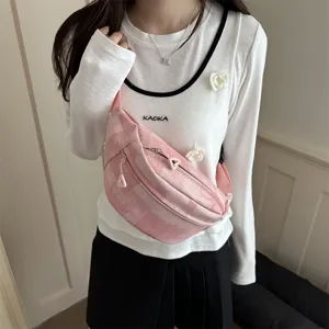 Stylish pink plaid sling bag for women, lightweight casual chest bag with zipper closure.
