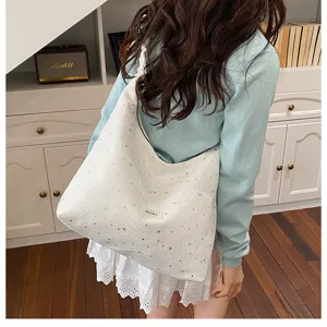 Detailed view of large capacity starlight print tote bag, casual slouchy cloth bag style.