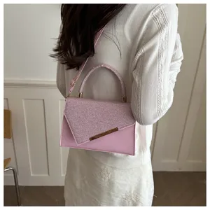 Detailed view of pink glitter flap crossbody handbag, showcasing stylish design for modern women.