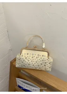 Élégante pochette de soirée rétro en strass avec poignée en métal, sac chic pour femmes.