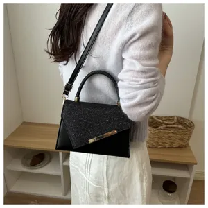 Black glitter crossbody bag for women, chic evening hand bag with top handle and strap.