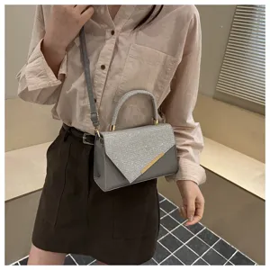 Detailed view of grey sequin handbag, stylish crossbody bag for women with elegant design.