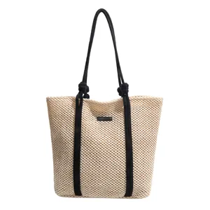 Casual geweven stro shopper tas voor dames, grote capaciteit hol design met zwarte handvatten.