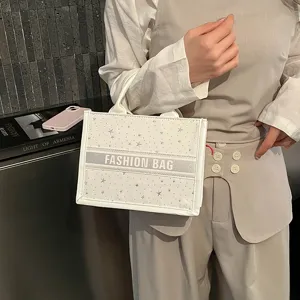 White star print canvas tote bag with top handles, fashionable casual handbag for women.