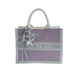 Chic purple star pattern canvas tote bag with white handles and silver star charm for women summer.