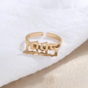 Gold stainless steel 1995 year ring, trendy gothic number statement jewelry detail view.
