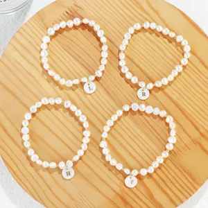 Natural freshwater pearl beaded bracelets with personalized letter charms for daily wear