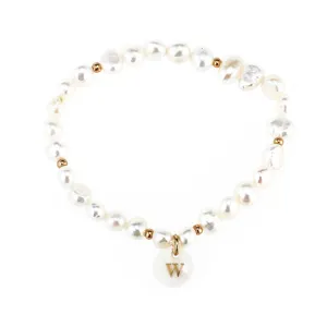 Freshwater pearl bracelet with letter pendant and gold spacer beads, elegant jewelry style.