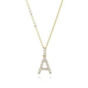 Detailed shot of gold letter A pendant necklace with full diamond pavé sparkling crystals.