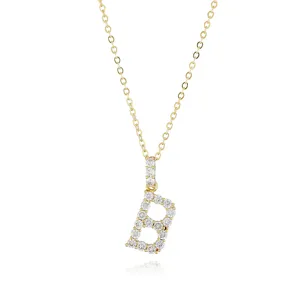 Gold-tone chain necklace featuring a sparkling pavé diamond letter B pendant detail.