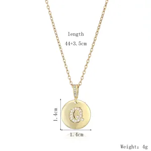 Detail view of the elegant gold-plated initial letter Q pendant necklace with sparkling crystals.