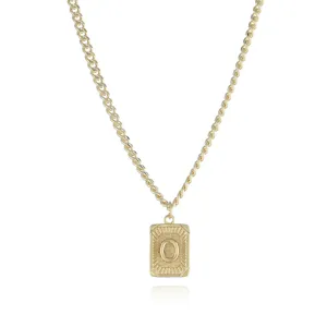 Golden metal chain necklace featuring a textured rectangular pendant with letter O detail.