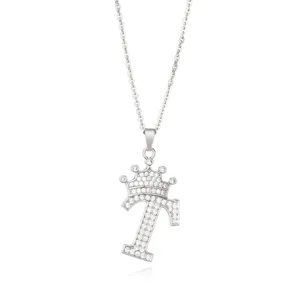 Detail shot of a silver letter T pendant necklace with sparkling micro-set zircons and crown.