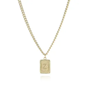 Close-up detail of the gold-plated letter Z pendant necklace with textured border.