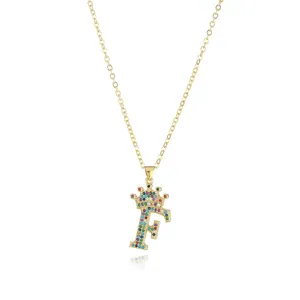 Detailed close-up of the dazzling rhinestone letter F crown pendant necklace, colorful crystal detail