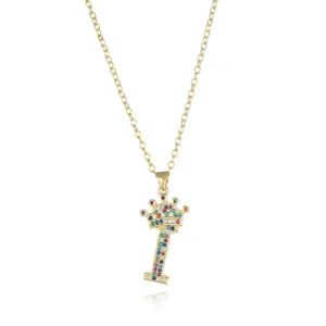 Detailed close-up of a gold letter I crown necklace featuring sparkling colorful zirconia stones.