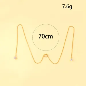 Gold tassel lip ring ear hanging accessory, stylish non-piercing body jewelry piece.