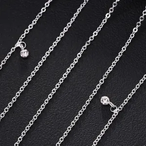 Rhinestone hair chain detail close-up, sparkling silver metal tassel forehead jewelry.