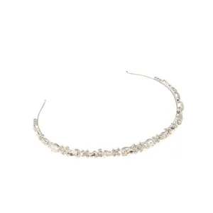 Rhinestone detailed crystal hair band close up view, elegant silver wedding bridal hair accessory.